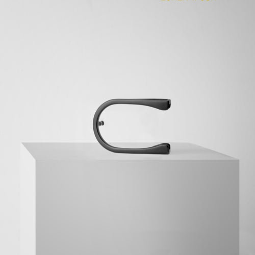 Buckle aero black lacquer on a podium